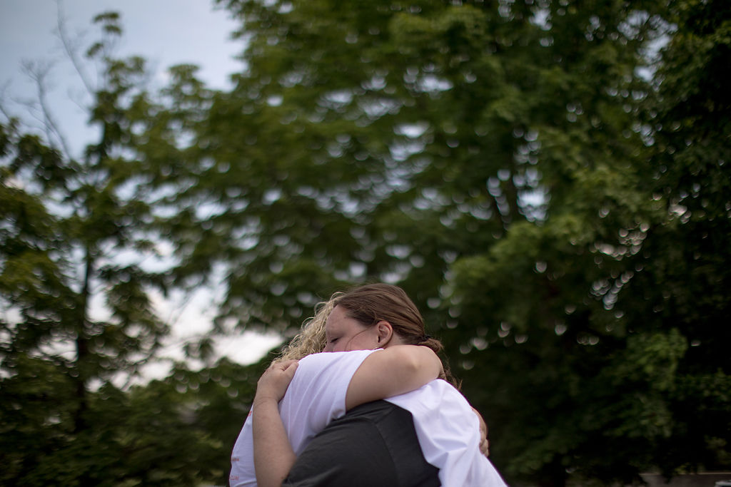 Cindy McDaniel, right, embraces Holly Bickmeyer at a protest at the Capitol